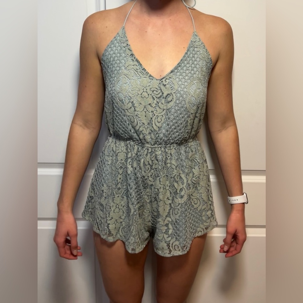 Turquoise open back romper with lace detailing, string tie, size small from Tobi
